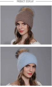 Detailed view of women's warm angora wool knit hats with luxurious raccoon fur pom-poms