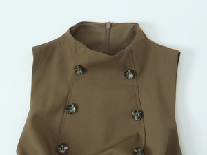 Close-up of brown sleeveless top with double-breasted amber buttons and standing collar
