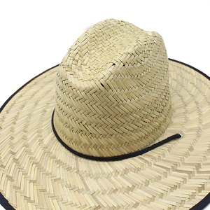 Natural straw sun hat with wide brim, black fabric trim and adjustable chin strap