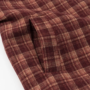 Women's plaid wool coat with deep red and brown checkered pattern and pocket detail