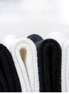 Detail shot of breathable cotton mesh texture on anti-pilling kids knee high socks