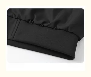 Detailed view of the high-density ribbed hem and stitching on this black casual jacket