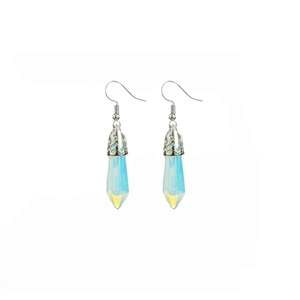 Detail of hexagonal opal column earrings with silver hollow textured metal hooks