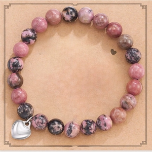 Pink zebra stone bead bracelet with silver heart charm on quote gift card display