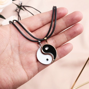 Matching Yin Yang necklaces for couples with stainless steel pendants and wax cords