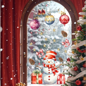 Detailed view of snowman and gift box window stickers in festive watercolor style