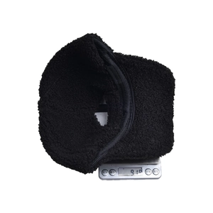 Solid black sherpa fleece baseball cap for outdoor warmth weighing 91g on scale
