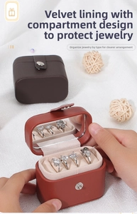 Detail of portable jewelry box with mirror, ring slots, and soft velvet interior lining