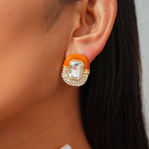 Close-up of vintage enamel stud earring with rectangle crystal and pavé rhinestones