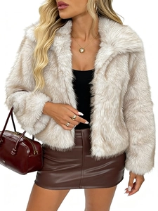 Detail of plush beige faux fur jacket showing high-quality texture and lapel collar design