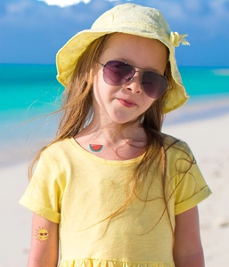 Waterproof glitter tattoos for kids featuring colorful summer sun and watermelon motifs