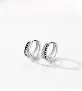 Close-up of S925 silver hoop earrings with double-row micro-set black and white zircons