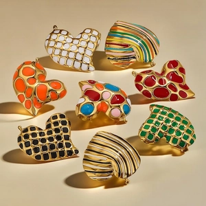 Handmade leopard heart enamel pendants with gold finish and vintage patterns