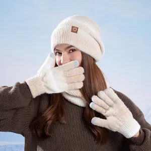 Three-piece winter knit set with beanie hat scarf and gloves in soft cream orange gradient