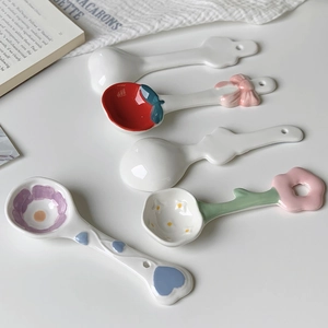 Cute hand-painted ceramic spoons featuring strawberry and flower shapes for dessert