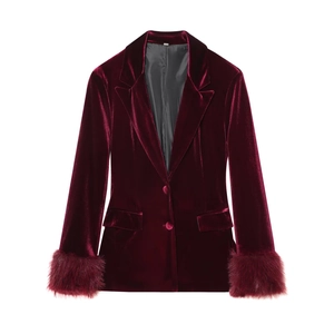 Detail of dark red velvet blazer featuring luxury faux fur trim cuffs and buttons