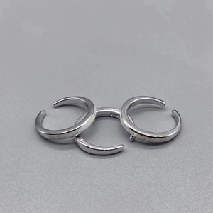 Detail view of three S925 sterling silver open rings showing inner hallmark stamps