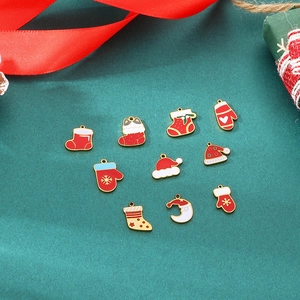 Detailed macro shot of 10-piece Christmas enamel pendants with glove and hat charms