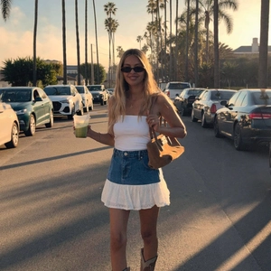 Slim fit denim mini skirt with white lace patchwork and ruffles in a summer street style