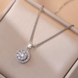 Elegant rotating silver flower pendant necklace featuring clear halo zircon settings