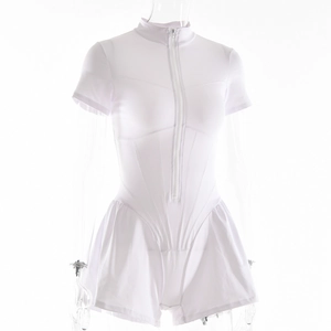 Detailed close-up of a white short-sleeve bodysuit with front zipper and pleated shorts