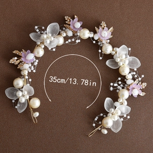 Detail of a 35cm handmade bridal headband with pearls, golden leaves and fabric flowers