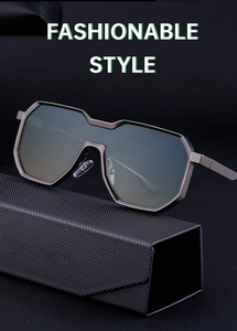 Detail of gunmetal octagonal sunglasses with gradient lenses on a textured black case