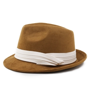 Detailed side view of the brown fedora hat showing textured felt and a white ribbon band