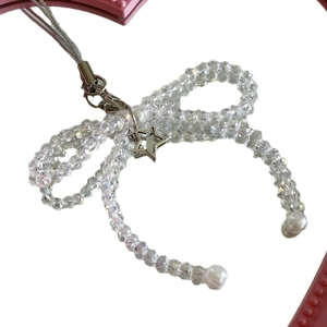 Handmade beaded phone strap with crystal bow, white pearls, and star metal pendant