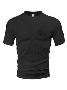 Detail of waffle knit fabric texture and chest pocket on a black men's short sleeve T-shirt