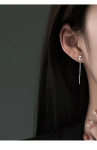 Detailed view of S999 silver earring wire with letter Z pendant and hanging bar detail