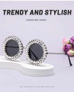 Close-up of oversized silver frames with hand-set rhinestones and black tinted lenses