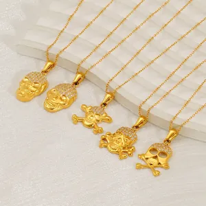 Hip hop 18k gold plated skull necklaces with crystals on marble background display