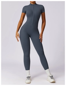 Detail of high-stretch slate grey yoga jumpsuit with front zipper and stand collar