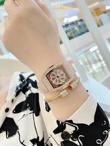 Close-up of luxury rose gold skeleton watch and diamond bracelet on a woman wrist