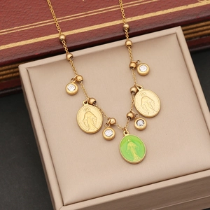 Gold Virgin Mary necklace set with green cat eye butterfly wings and zircon stones