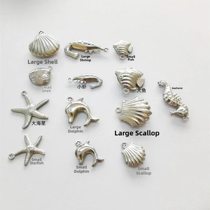 Detailed collection of stainless steel ocean themed charms featuring starfish and shells