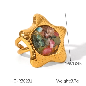 Detail of starfish ring in gold metal with colorful natural stone inlay and dimensions