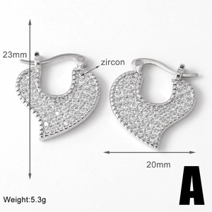 Detailed view of silver heart earrings with zircon inlay, size 23mm by 20mm and 5.3g weight