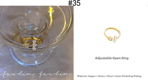Close-up of adjustable gold ring with heart-shaped zircon and three vertical pearls