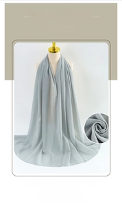 Detail of light grey bubble chiffon scarf texture and draping on a mannequin