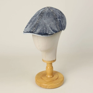 Vintage washed denim flat cap for men and women featuring a distressed blue-grey finish