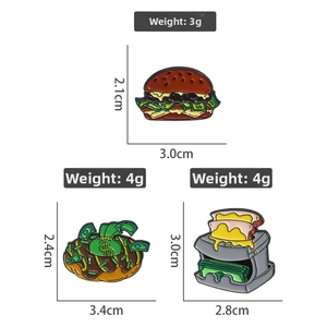Detailed size and weight specs for burger and donut enamel pins with money motifs
