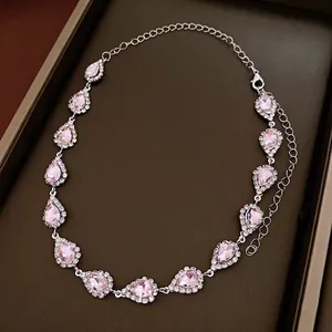 Elegant floral necklace set featuring pink teardrop crystals with a diamond-studded halo