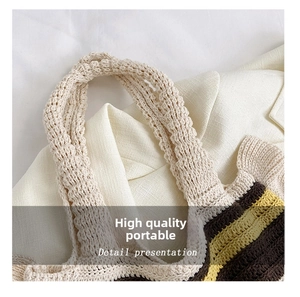 Detail presentation of hand-woven cotton shoulder bag handle with striped pattern