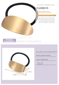 Detail of golden brushed metal oval hair tie with 5.1cm length and black elastic band