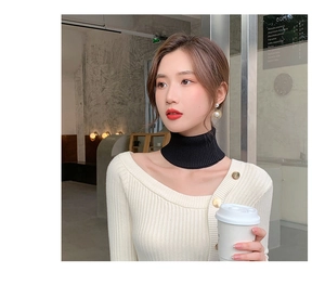 Close-up of a black knitted turtleneck false collar for neck warmth and layering