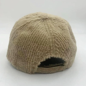 Detail view of khaki faux mink fur baseball cap with adjustable strap for winter warmth