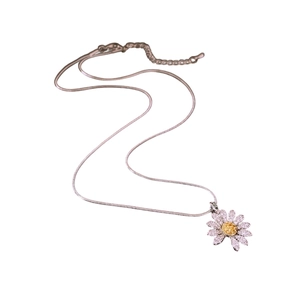 Daisy pendant necklace with white and yellow zircon on silver snake chain over white background