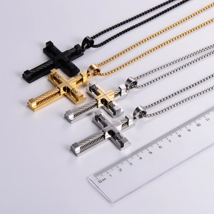 Cross necklaces in steel, gold and black with steel wire inlays and measuring ruler